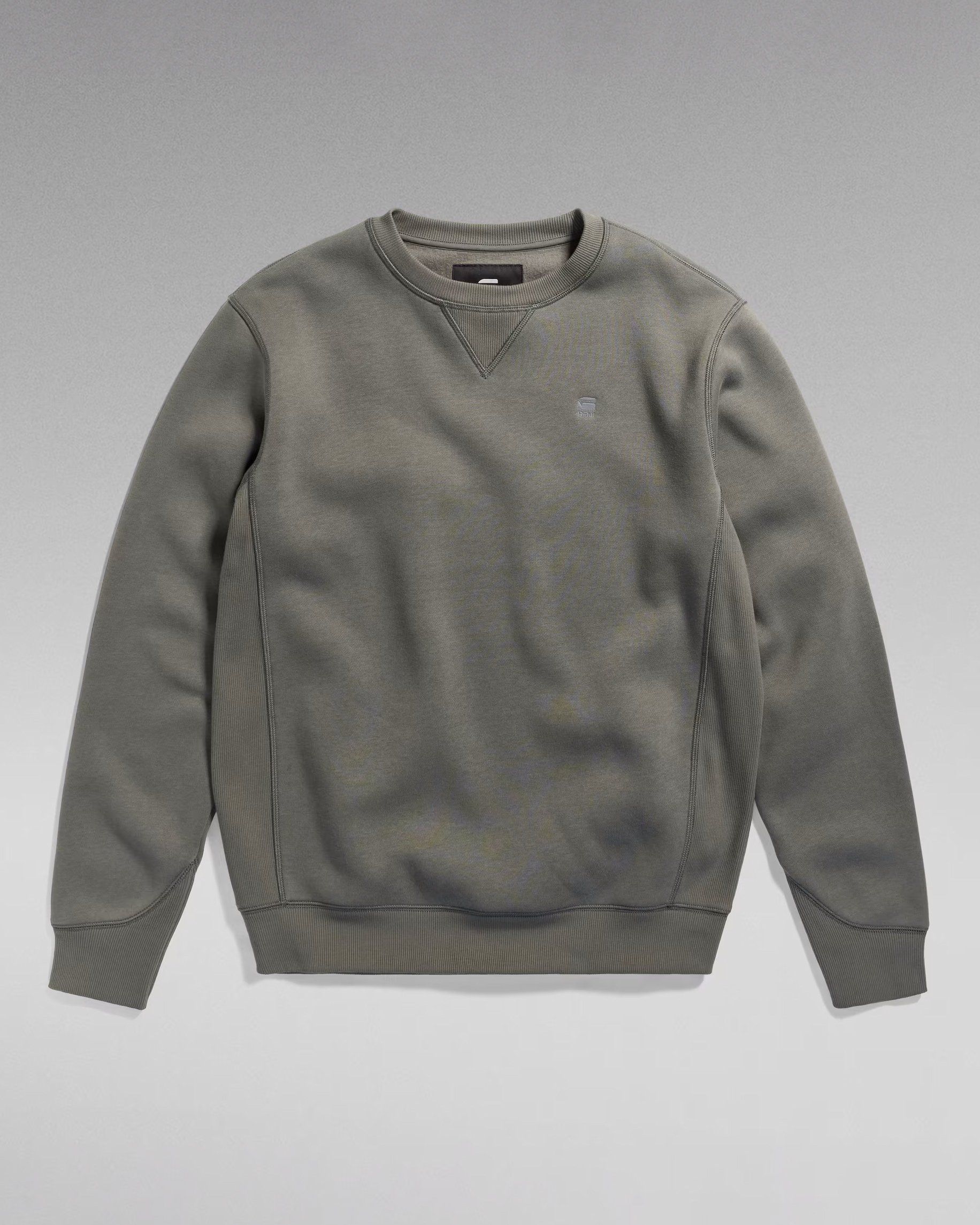Olive grey crew-neck sweatshirt, flat lay on a grey gradient background, G-Star RAW