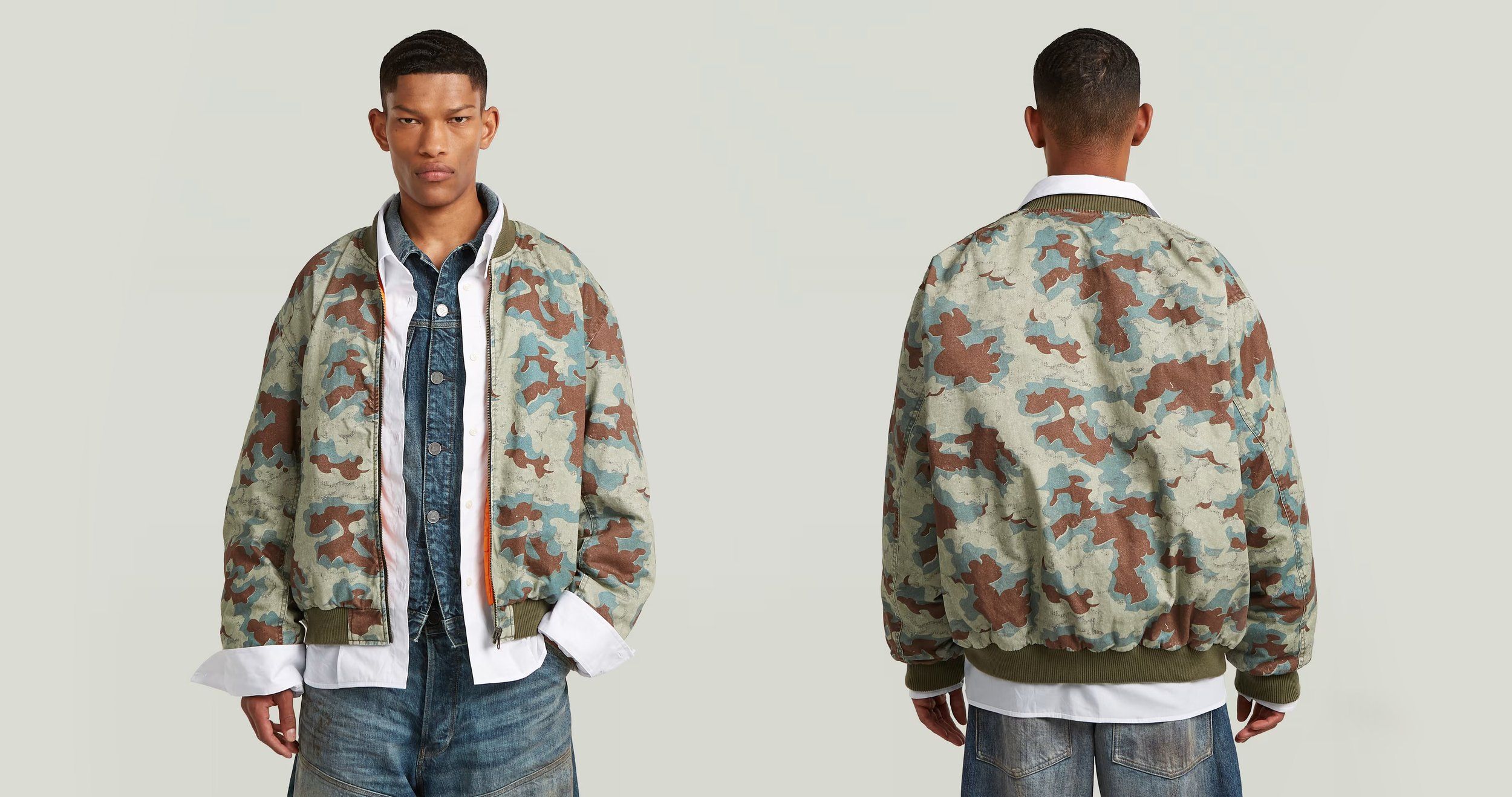 Front and back views of a camouflage bomber jacket over a white shirt and denim, male model, light grey background