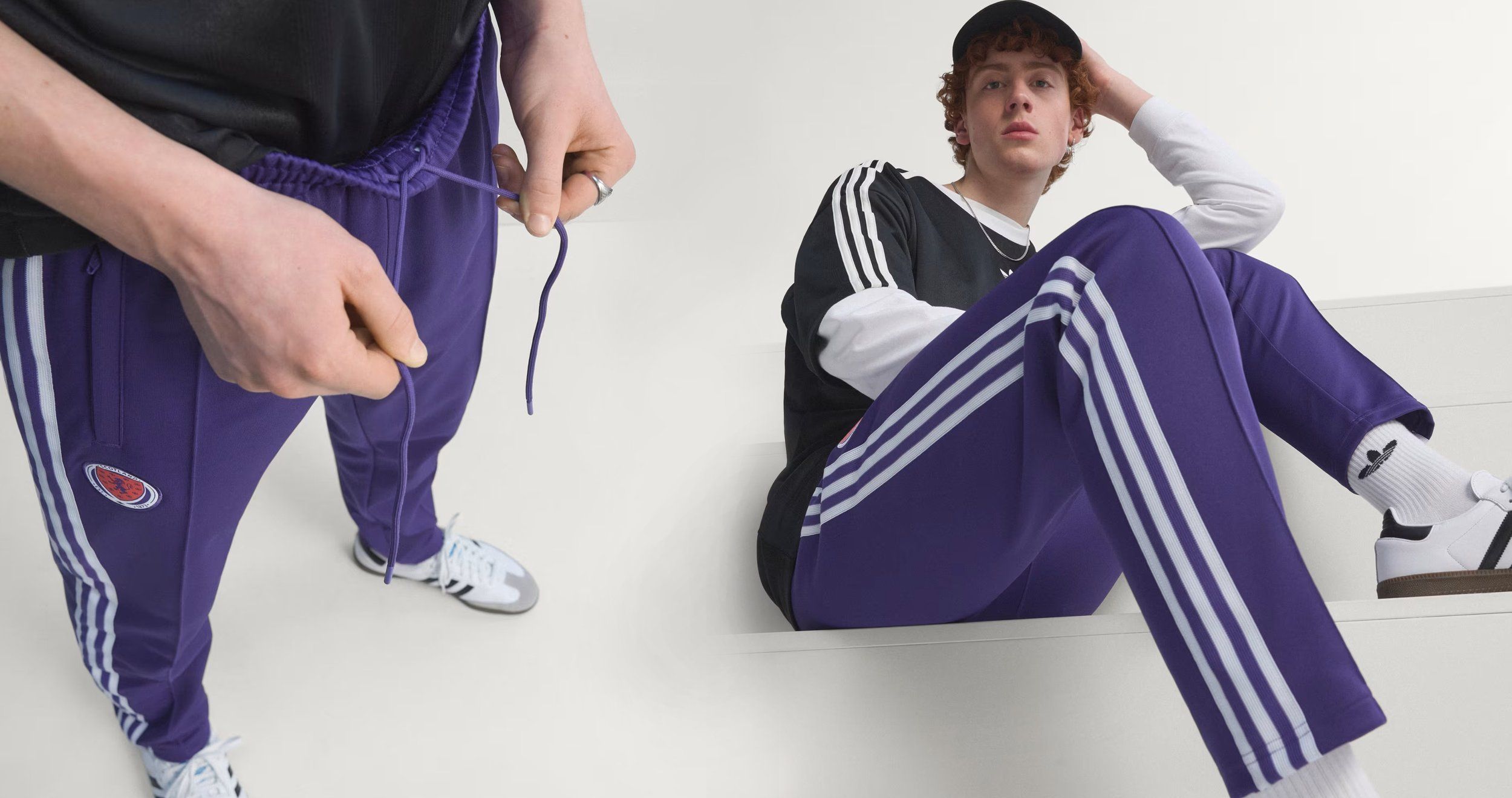 Close-up of purple adidas track pants with white stripes and drawstring, plus a seated model in a black tee and cap