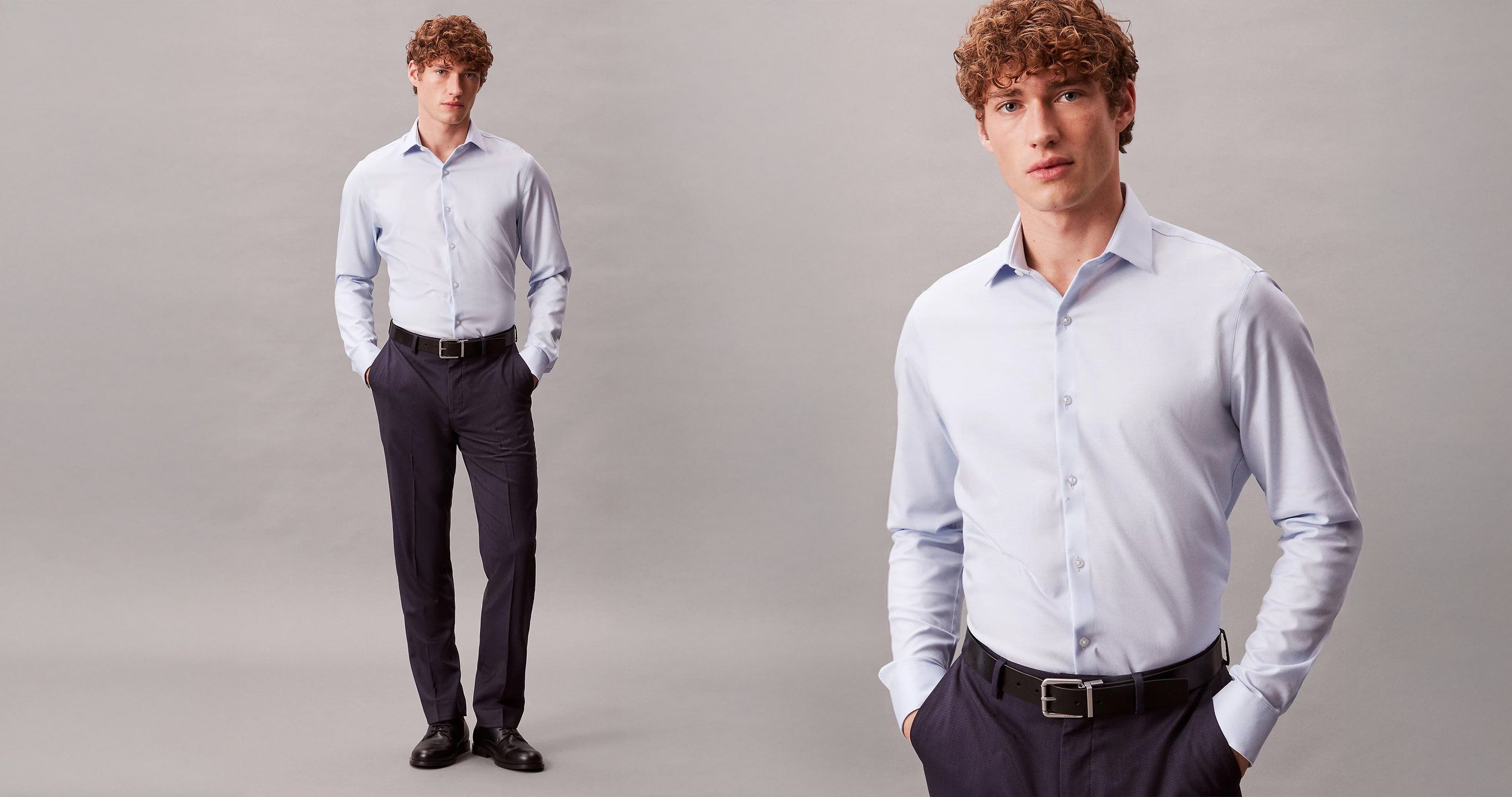 Male model in a light blue dress shirt and dark trousers, full-length and three-quarter crop, plain grey background