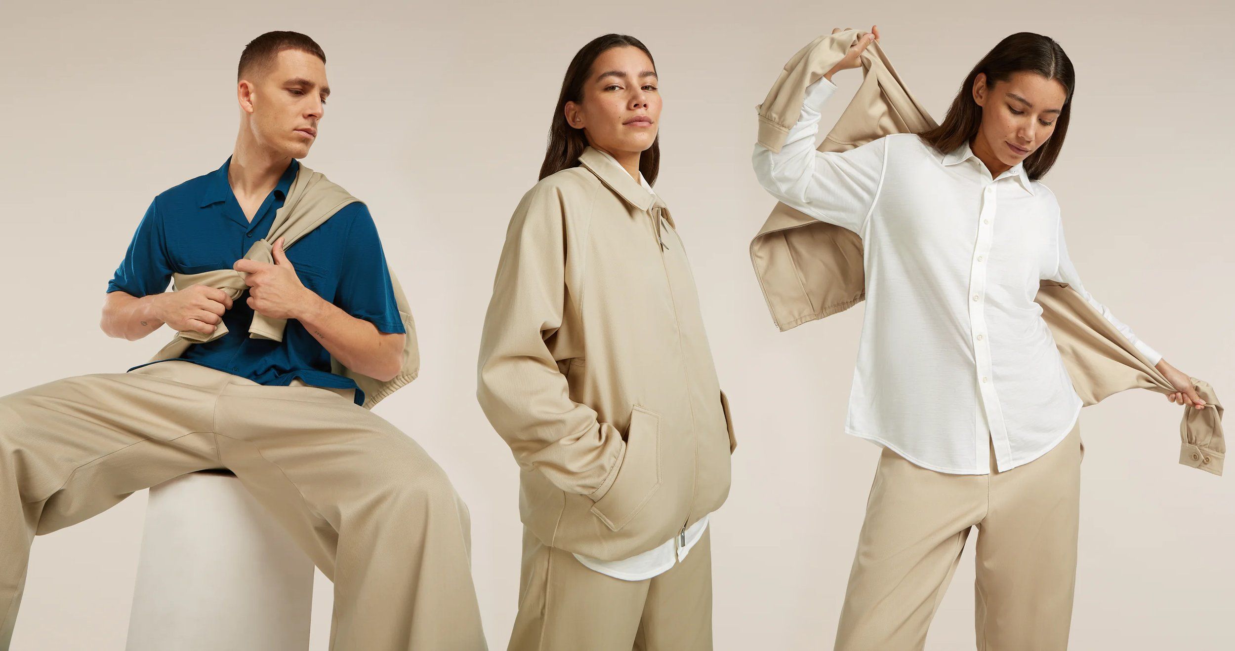 Three models in Icebreaker beige and white casualwear: a blue polo with knotted jacket, a tan jacket, a white shirt